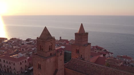 Aerial-view-of-Cefalu-medieval-city-during-summer-at-sunset,-Sicily,-Italy