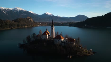 drone flies above bled island in lake bled, slovenia