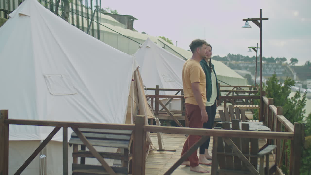 Couple Enjoying View from Terrace at Glamping