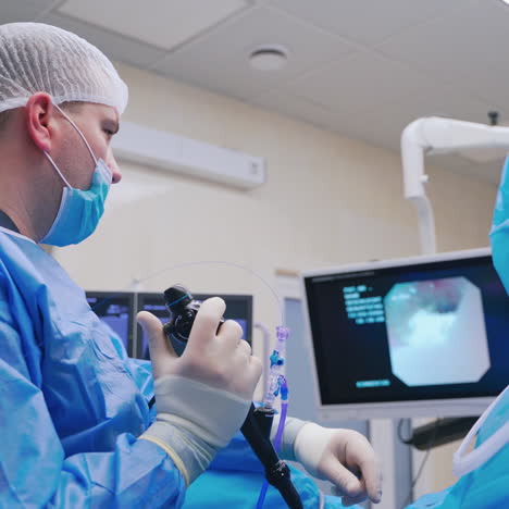 laparoscopic surgery. professional surgeon performing endoscopy surgery. doctor looking on the monitor during the operation. new technologies in medicine.