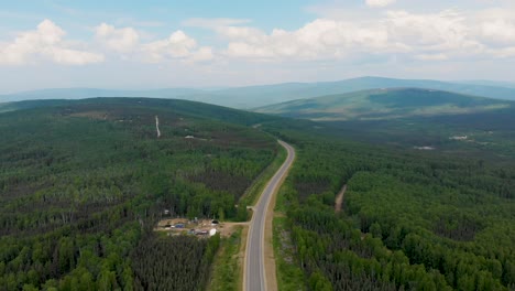 4k drone video of elliott highway through white mountains near fox, alaska on summer day