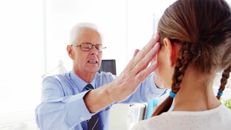 Male-doctor-interacting-with-patient