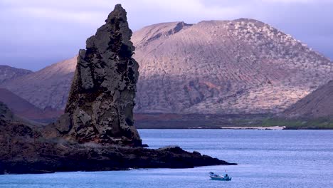 pinnacle rock a volcanic tufa cone is a landmark in the galapagos islands 3