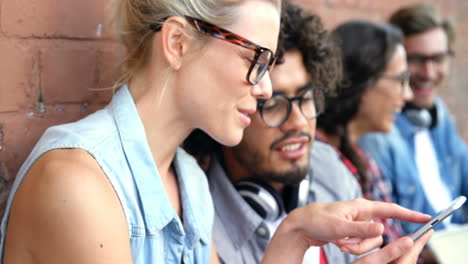 Friends-interacting-while-using-smartphone