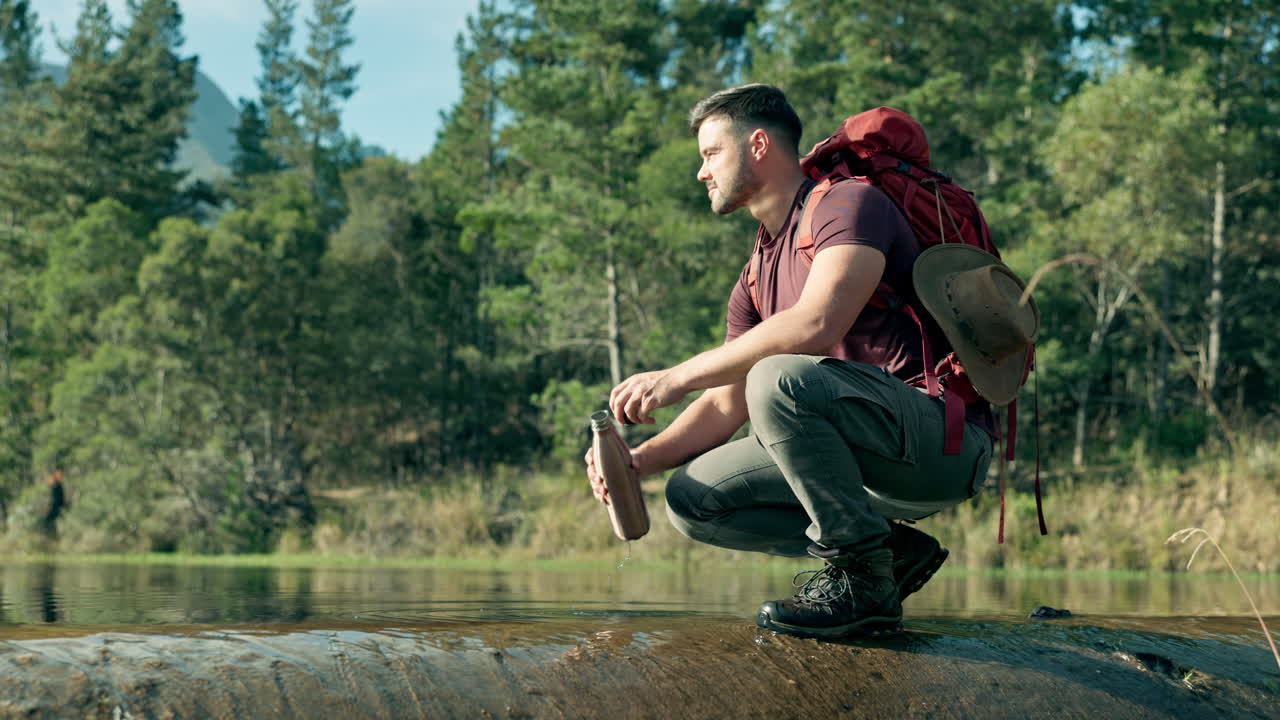Bottle, hiking or man by river water in nature