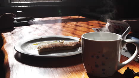 breakfast with pancakes and a cup of coffee in an early morning lodge