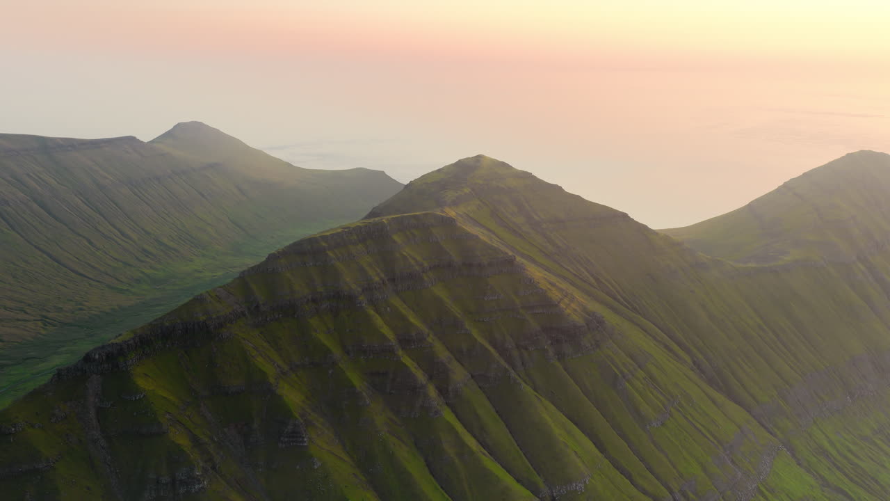Panoramic Aerial View of Green Mountain Peaks at Sunset