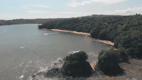 Aerial-flying-over-coast-of-Bagamanoc-on-sunny-day