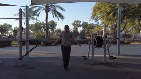 young man skipping rope. slow motion.