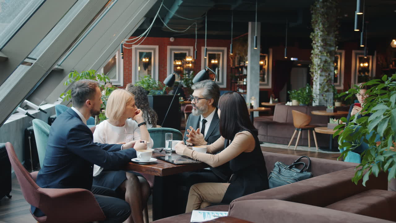 Business Meeting in a Modern Cafe