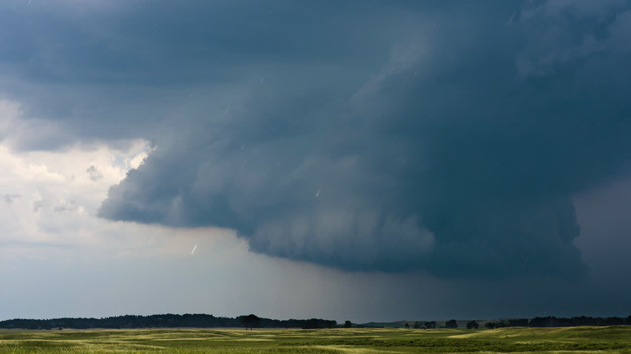 Threatening powerful severe storm darkens the sky as it closes in