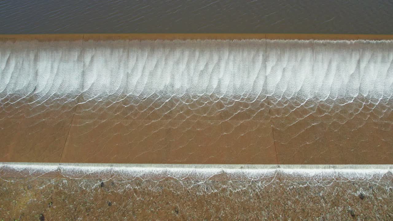 Close up view of water spilling over the Upper Coliban Reservoir spillway, central Victoria, Australia