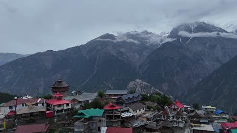 aerial drone shot of kalpa, a scenic himalayan town, with the breathtaking kinner kailash range.