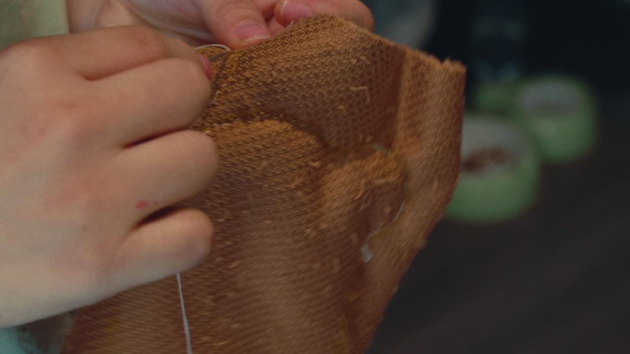 Close-up of someone sewing