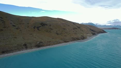 panorama of lake tekapo, alpine lake in mackenzie basin of south island, new zealand. - aerial shot