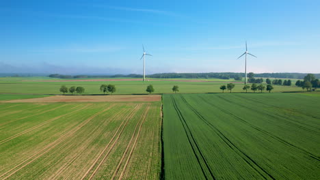 Beautiful-farmland,-windmills,-lush-green-crops.-Aerial-drone