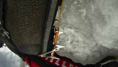 Closeup-of-climbers-crampons-in-ice