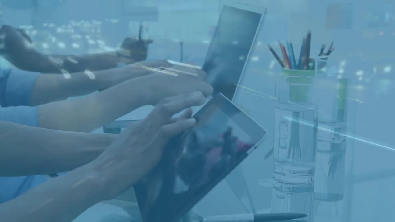 Office workers using tablet and laptop with traffic