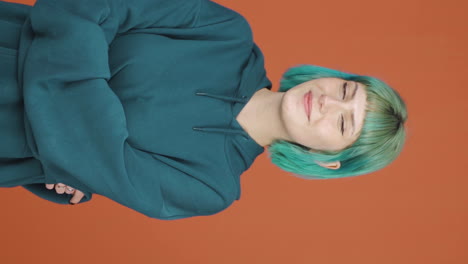 vertical video of young woman smiling at camera