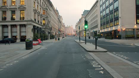 lockdown in london, walking up completely empty waterloo place towards piccadilly circus lights during the covid-19 pandemic 2020.
