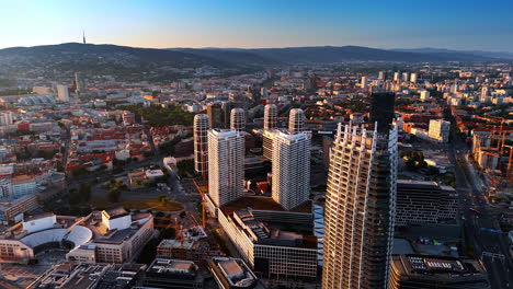 modern design high-rises towering over the urban landscape. aerial perspective on bratislava, slovakia at sunset