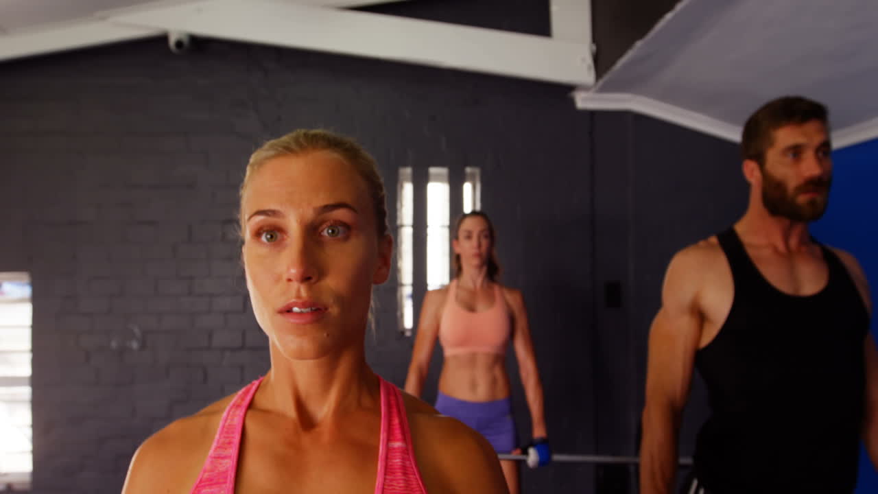Group of people lifting barbell