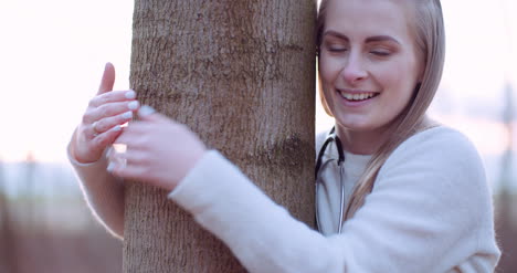 beautiful loving nature woman hugs tree in forest in autumn 3