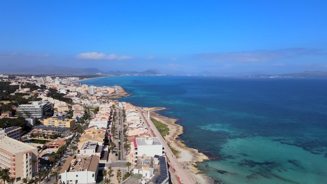 Breathtaking panorama showcasing the vibrant shoreline of Can Picafort and the sparkling blue waters of Son Baulo. A perfect day under the sunny sky invites relaxation and adventure.