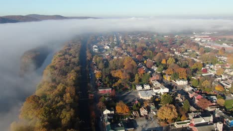 airplane view of thick fog cloud over american neighborhood