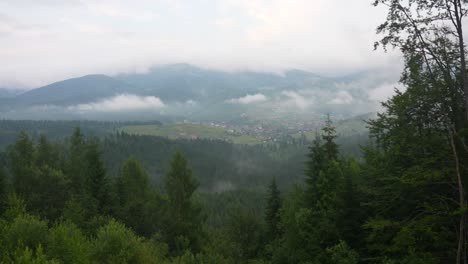 misty mountain valley with village
