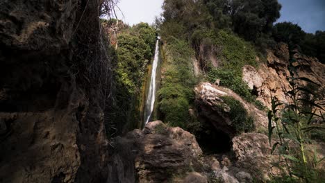 Magical-waterfall-in-between-rocky-cliffs,-static-view