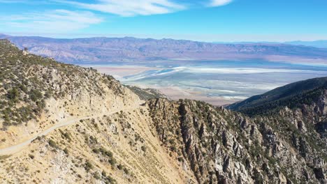 Aerial-over-a-winding-mountain-road-along-a-ridge-in-the-Eastern-Sierra-mountains-near-Lone-PIne-and-the-Owens-Valley-california-1