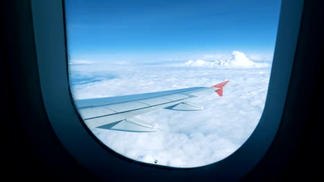 the view from the window of the plane on the wing and clouds.