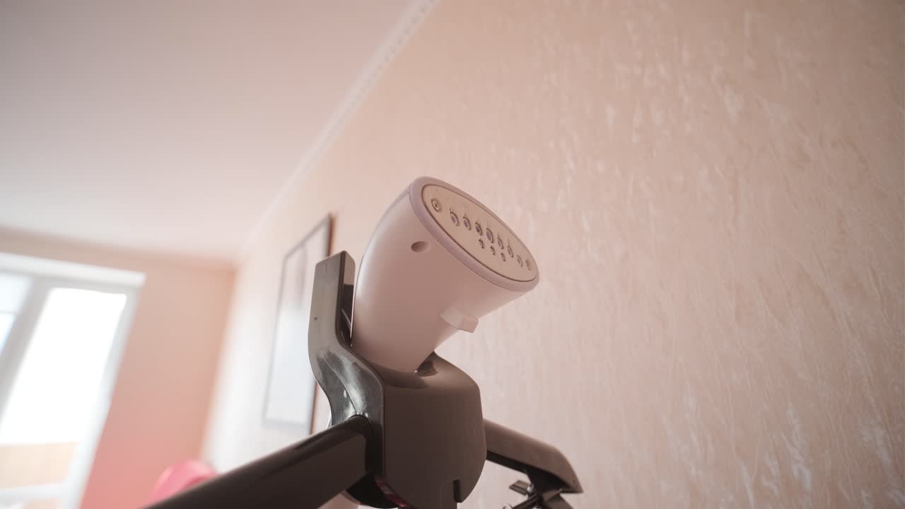 Close-up of a Garment Steamer Head Emitting Hot Steam