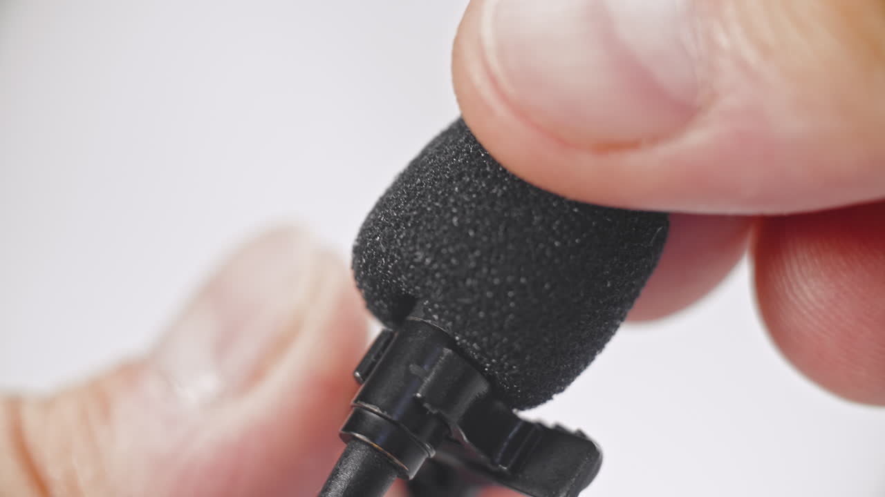 close up of a lavaliere microphone for audio recording podcasts filmmaking
