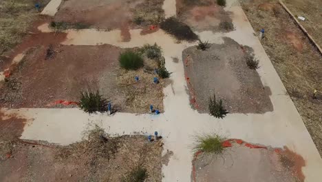 Aerial-flyover-deserted-overgrown-concret-foundation