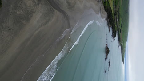 Aerial-circling-Monkey-Island-beach-area-on-cloudy-day