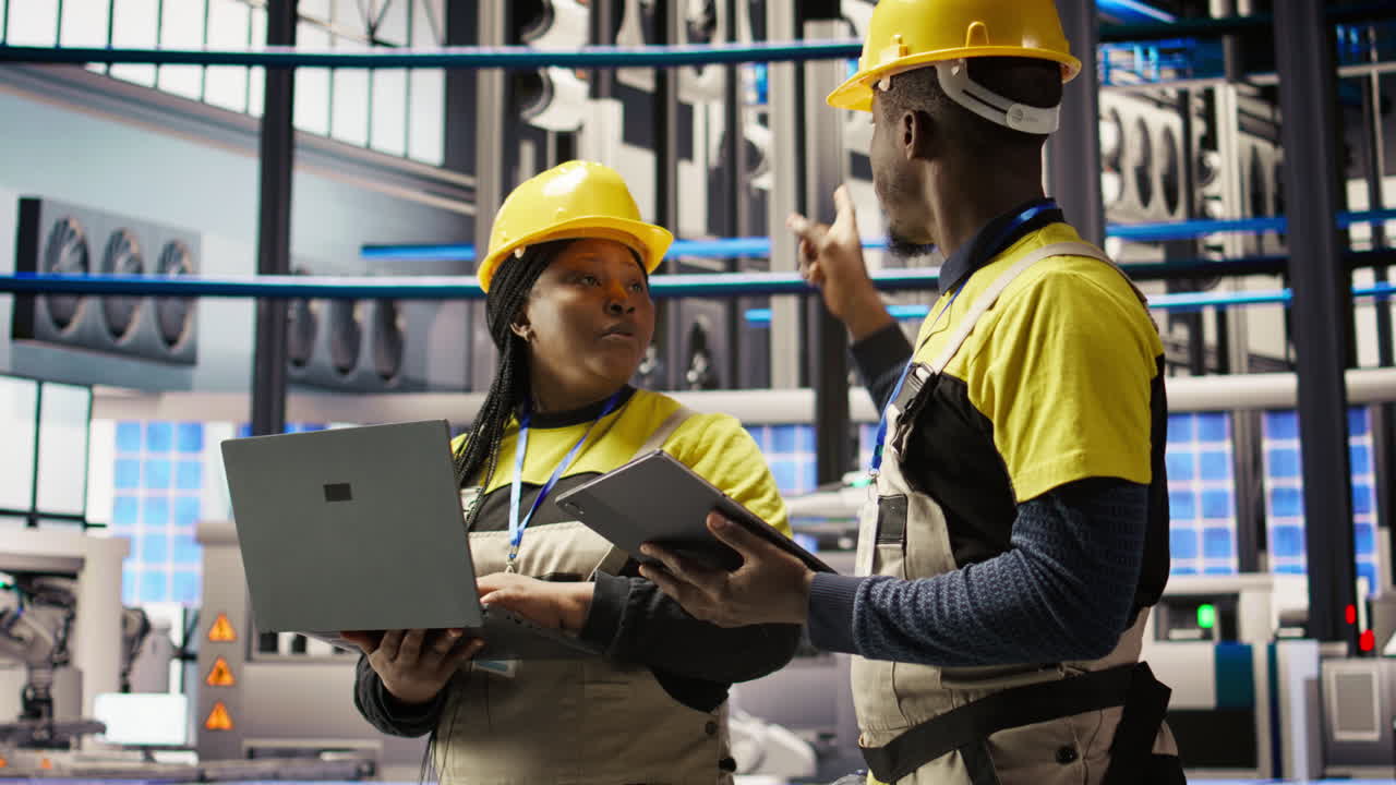 Vertical video Engineering team working together in industry 4.0 plant