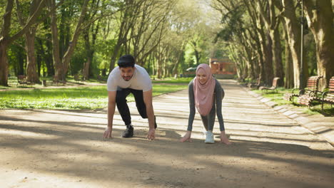 couple exercising in a park