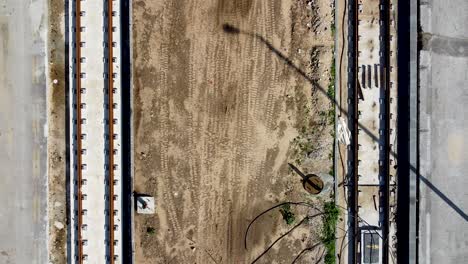 aerial slow zoom-out drone shot top down of an construction light rail jaffa, israel