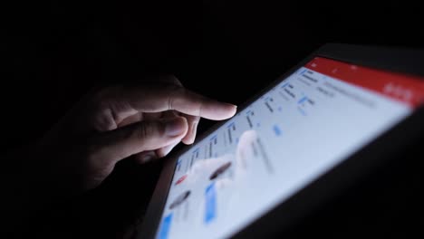 person using a tablet at night