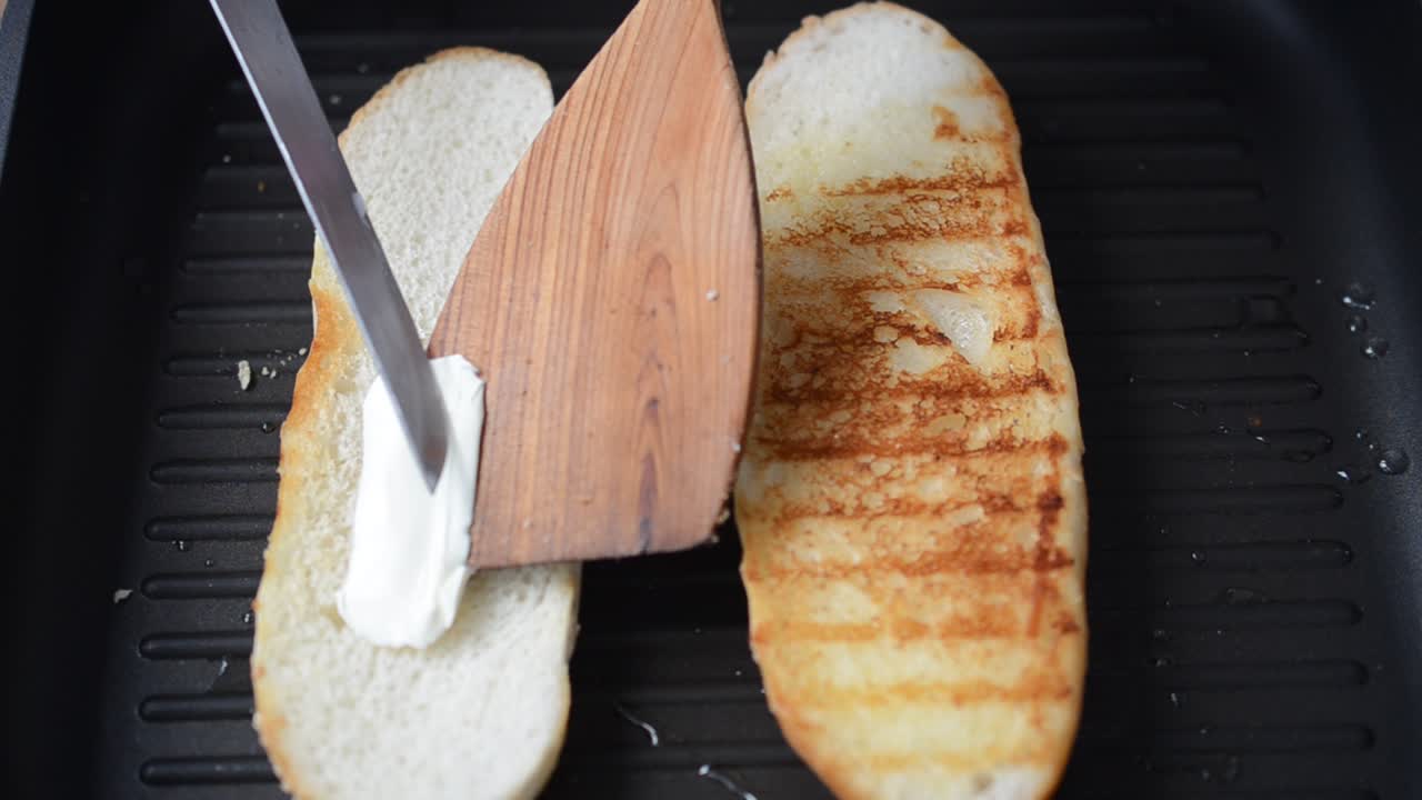 We fry sandwiches. Shooting in kitchen. Process of preparation of a dish