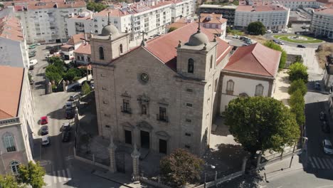 aerial orbiting são miguel church facade, downtown castelo branco city - portugal