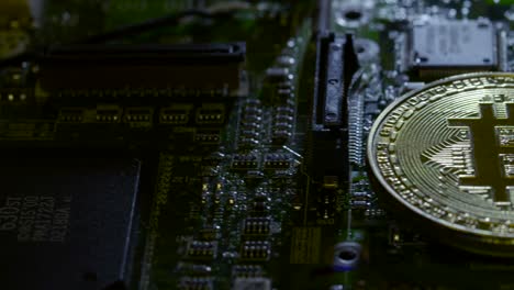 reveal shot of a casascius bitcoin on a circuit board