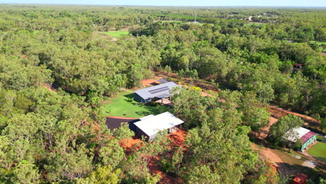 modern rural home with energy efficient solar roof aerial drone