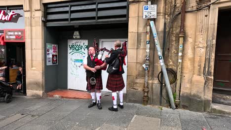 bagpiper playing on street during festival