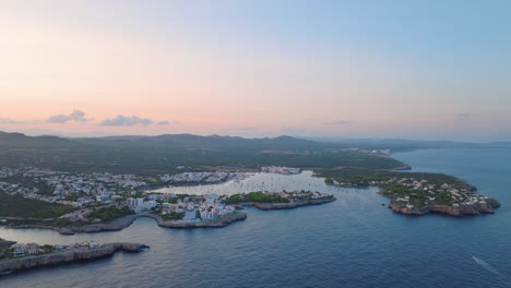 aerial sunset view of a coastal town in the mediterranean