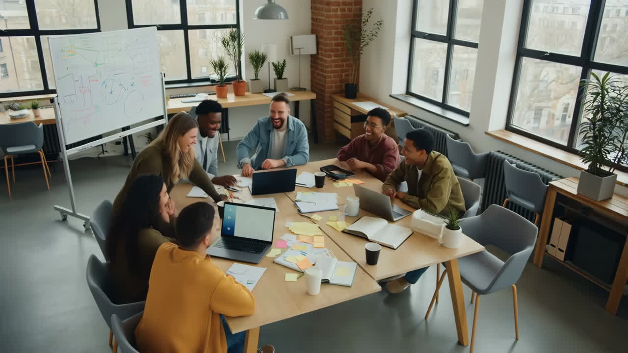 A diverse group of professionals collaborating and brainstorming during a business meeting in a modern office