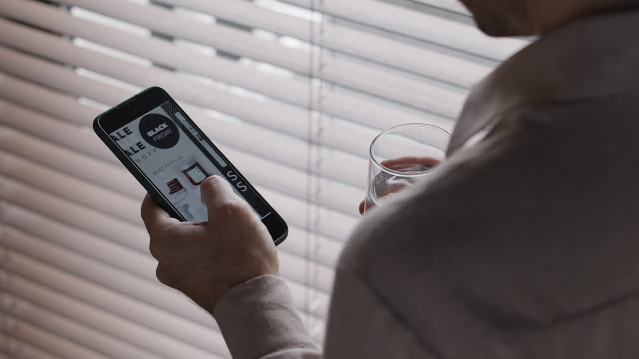 Person browsing Black Friday sales on a smartphone