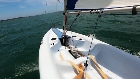 Sailor-POV-shot-while-solo-sailing-dinghy-boat-in-Southern-Vietnam-on-a-beautiful-sunny-day